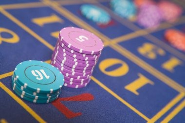 Live Three Card Poker dealer studio with multiple camera angles and clear card display